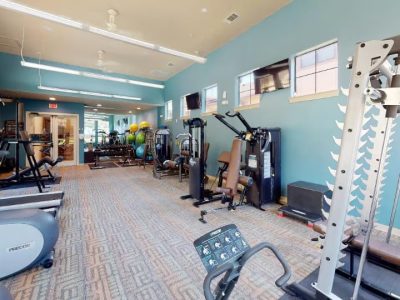 Vista Ridge Apartments-in-friedrich-wilderness-park-nw-san-antonio-a-gym-room-with-a-treadmill-and-other-exercise-equipment-available-for-residents-of-apartments-in-nw-san-antonio